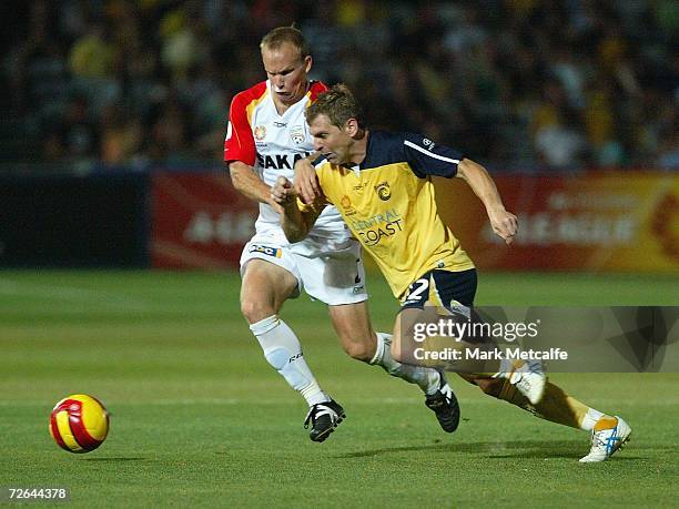 Stewart Petrie of the Mariners and Richie Alagich of Adelaide compete for the ball during the round fourteen Hyundai A-League match between the...