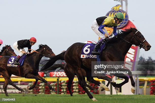 Deep Impact of Japan ridden by Yutaka Take runs past the finishing post to win the 26th Japan Cup at Tokyo Race Course on November 26, 2006 in Tokyo,...