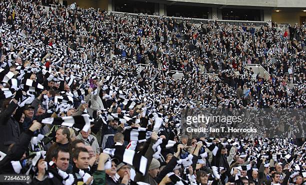 Newcastle fans wave their scarves during the Barclays Premiership match between Newcastle United and Portsmouth at St.James' Park on November 26,...