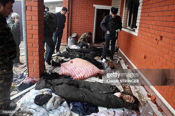 Russian police officers work at the site where Russian security forces killed five people including a Jordanian described as an Al-Qaeda leader, in...