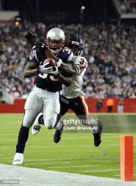 Running back Laurence Maroney of the New England Patriots gets pushed out of bounds by Charles Tillman of the Chicago Bears to set up a touchdown in...