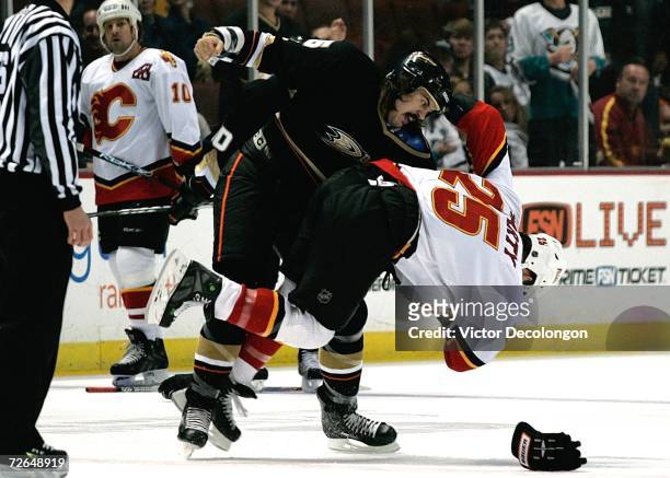 George Parros of the Anaheim Ducks throws a punch in a fight against Darren McCarty of the Calgary Flames during their game at Honda Center on...