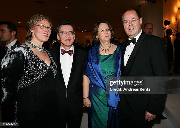 Head of the Chancellery Thomas de Maiziere with his wife Martina de Maiziere and German Finance Minister Peer Steinbrueck with his wife Gertrud...