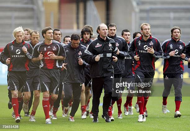 Assistant-coach Roland Koch leads the players during a warm up during the 1.FC Cologne training session on November 27, 2006 in Cologne, Germany.