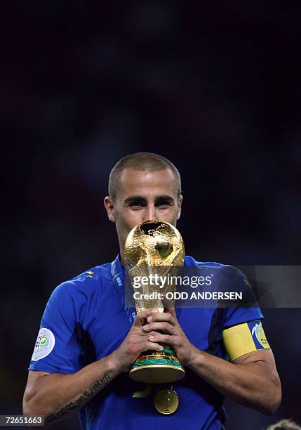 - Picture taken 09 July 2006 of Italian defender Fabio Cannavaro kissing the trophy after the World Cup 2006 final football game Italy vs.France at...