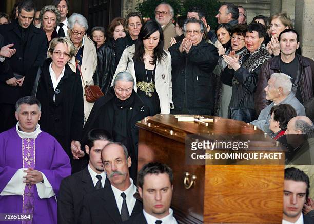 The widow of French actor Philippe Noiret, Monique Chaumette , and their daughter Frederique , follow the coffin out of the Sainte-Clotilde basilica,...