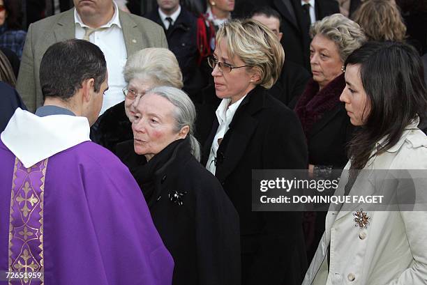 The widow of French actor Philippe Noiret, Monique Chaumette , and their daughter Frederique , leave Sainte-Clotilde basilica, 27 November 2006 in...