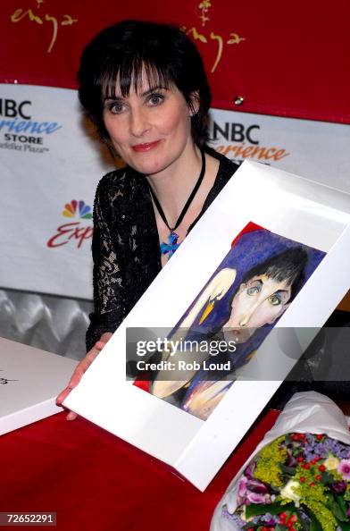 Recording artist Enya receives a gift from a fan at her holiday CD