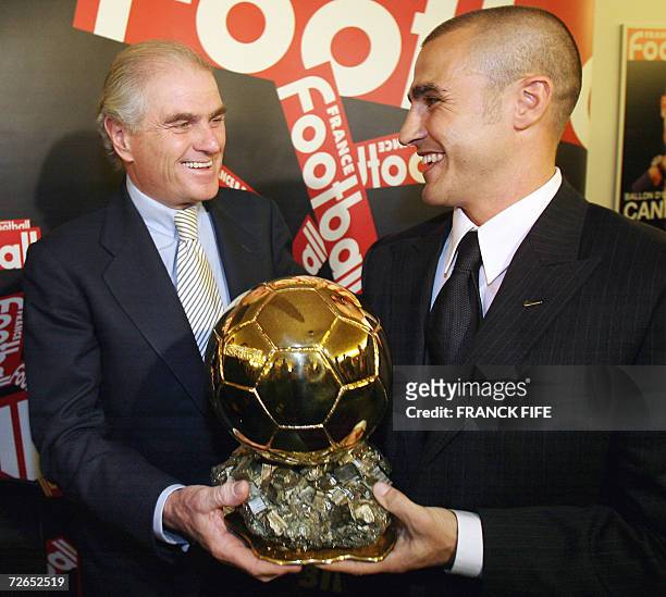 Italy's World Cup-winning captain Fabio Cannavaro is congratuled by President of Real Madrid, Ramon Calderon after being awarded the 2006 'Ballon...
