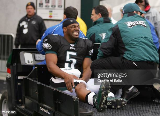 Donovan McNabb of the Philadelphia Eagles is carted off the field after injuring his right knee in the second quarter against the Tennessee Titans on...