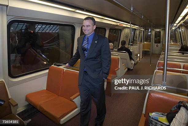 Vienna, UNITED STATES: Virginia Governor Timothy Kaine rides aboard the Washington, DC, Metro 27 November 2006 en route to the Ballston, VA, area,...
