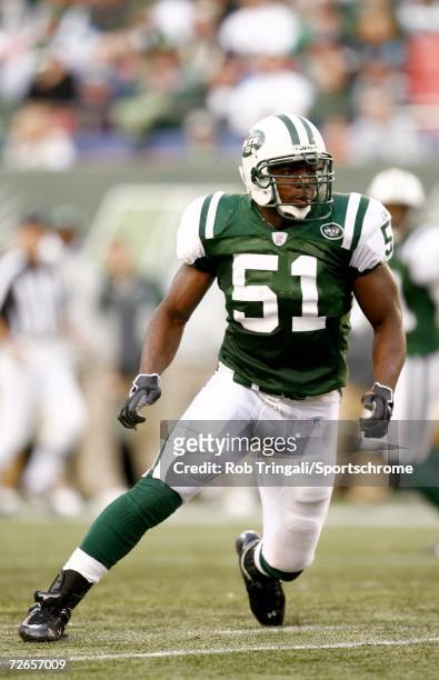 Linebacker Jonathan Vilma of the New York Jets defends against the Houston Texans at Giants Stadium on November 26, 2006 in East Rutherford, New...