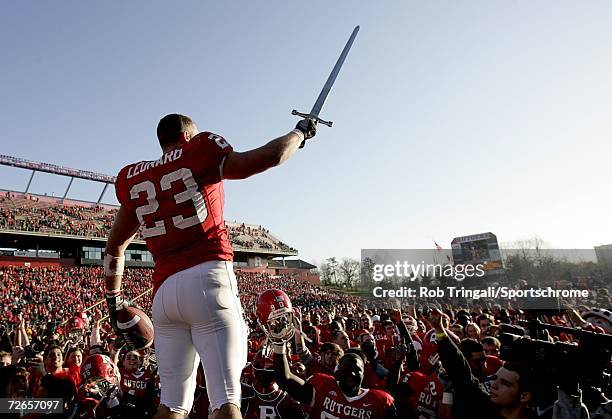Running Back Brian Leonard of the Rutgers Scarlet Knights waves farewell to the crowd and his team after defeating the Syracuse Orange during his...
