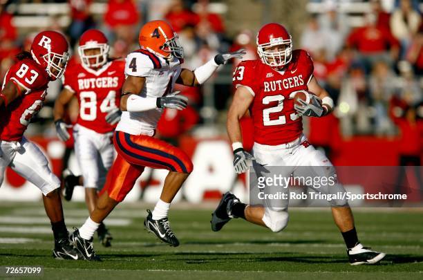 Running Back Brian Leonard of the Rutgers Scarlet Knights runs with the ball while being chased by Terrell Lemon of the Syracuse Orange at Rutgers...