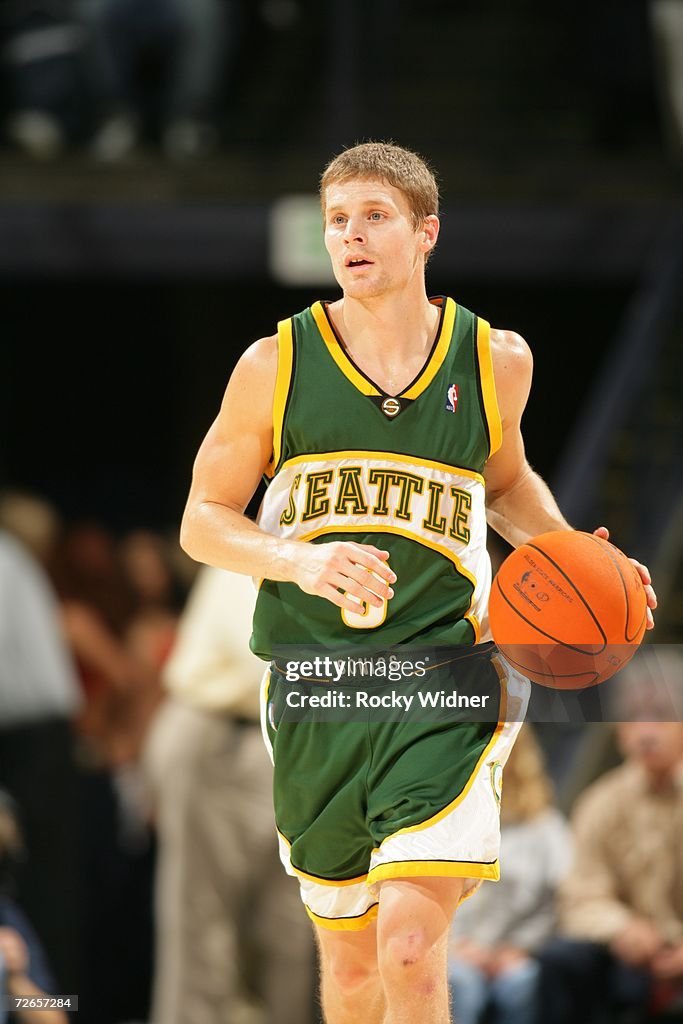 Luke Ridnour Of The Seattle Sonics Controls The Ball Against The luke-ridnour-of-the-seattle-sonics-controls-the-ball-against-the