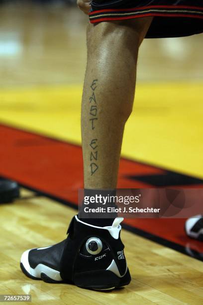 Tattoo on the leg of Allen Iverson of the Philadelphia 76ers is shown during game against the Miami Heat November 27, 2006 at the American Airlines...