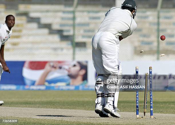 Pakistani cricketer Shahid Nazir is clean bowled by West Indies bowler Daren Powell during the second day of the third and final Test match between...