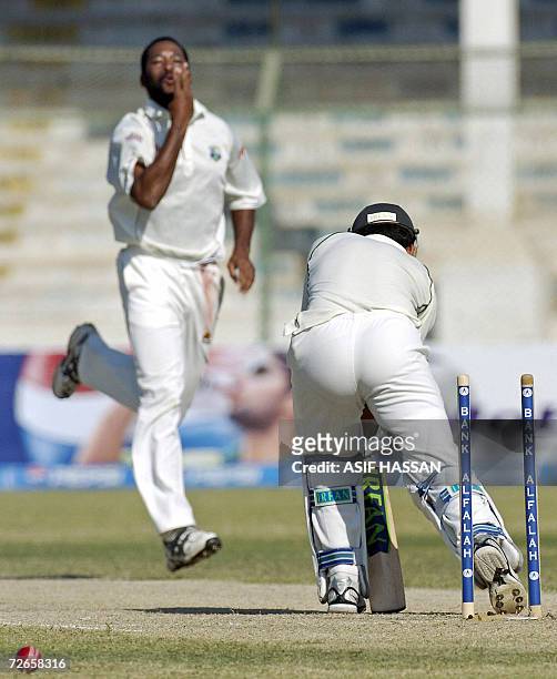 Pakistani cricketer Kamran Akmal is clean bowled by West Indies bowler Corey Collymore during the second day of the third and final Test match...