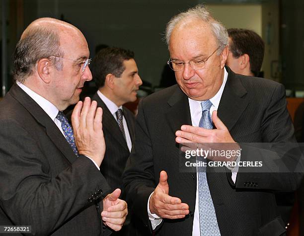 European Union monetary Affairs commissioner Joaquim Almunia chats with Slovenian Finance minister Andrej Bajuk prior an ECOFIN meeting 28 November...