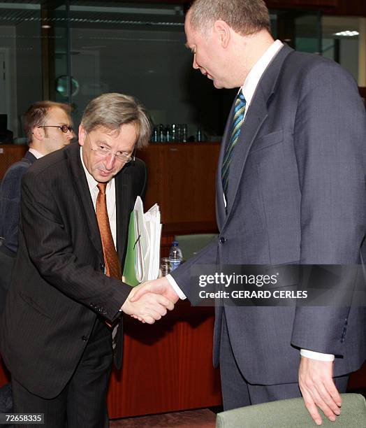 Luxembourg Prime minister Jean Claude Juncker jokes with Finnish Finance minister and current Chairman of the Council Eero Heinaluoma prior an ECOFIN...