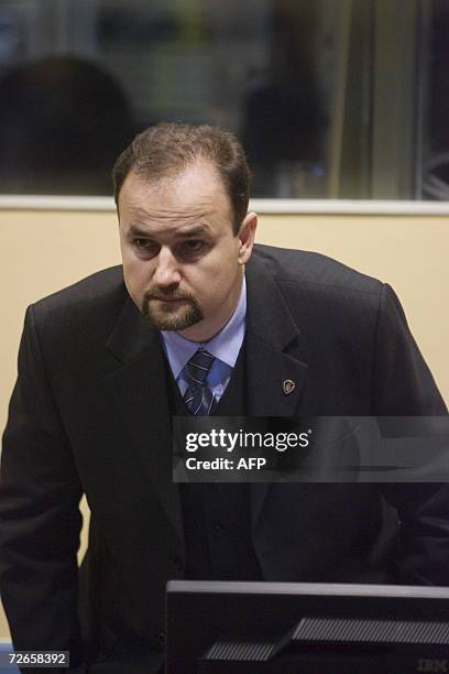 Den Haag, NETHERLANDS: Bosnian Serb defendant Blagoje Simic takes a seat in the courtroom of the International Criminal Tribunal for the Former...