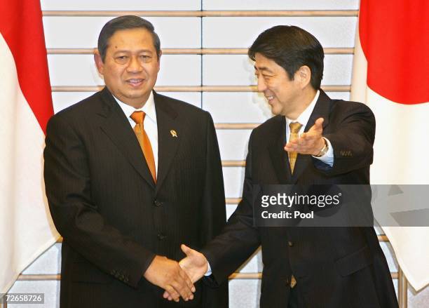 Japanese Prime Minister Shinzo Abe welcomes Indonesian President Susilo Bambang Yudhoyono during their talks at Abe's official residence on November...