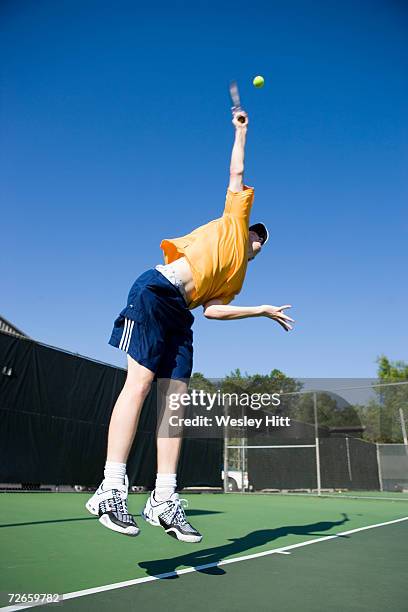teenage boy (16-17) playing tennis, low angle view - mission court grip stock pictures, royalty-free photos & images