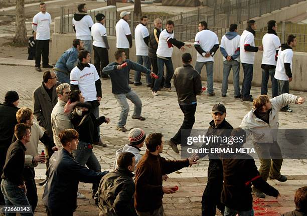 Pristina, SERBIA AND MONTENEGRO: Ethnic Albanian protesters throw red bottles and rocks at the government building in Pristina, 28 November 2006....