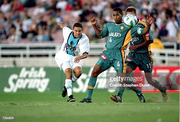 Manny Lagos of the Tampa Bay Mutiny runs for the ball past Robin Fraser of the Los Angeles Galaxy at the Rose Bowl in Pasadena, California. The...