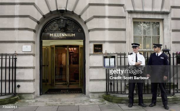 Two British police officers stand outside of the Millennium Hotel in Grosvenor Square on November 28, 2006 in London, England. Detectives are...