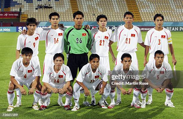 Players from Bahrain pose for a picture before the 15th Asian Games Doha 2006 Men's Group B 2nd Round football match between Bahrain and Vietnam at...
