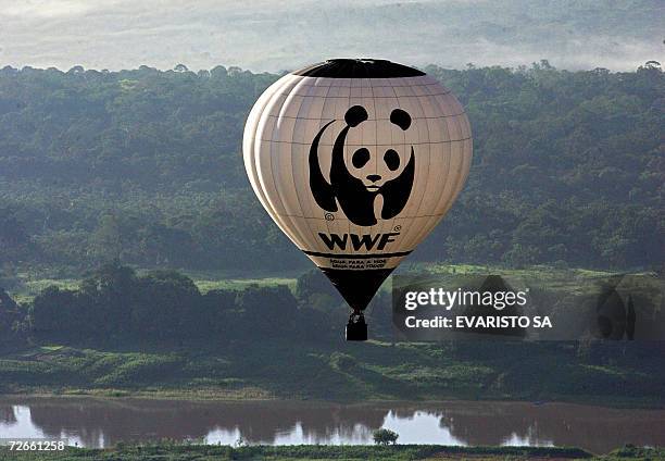 World Wildlife Fund balloon flies over the Amazonas river and the surrounding rain forest in Manaus, north of Brazil, 28 November 2006. WWF tries to...