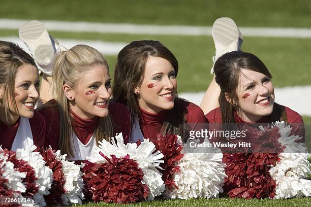 Arkansas Razorback cheerleaders pose for photos before a game against the LSU Tigers at War Memorial Stadium on November 24, 2006 in Little Rock,...