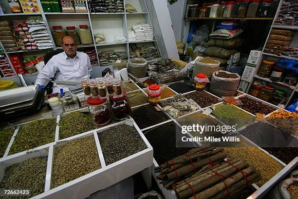 Qatari man sells herbs and spices in Souq Waqif on November 28, 2006 in Doha, Qatar. Souq Waqif has been recently redeveloped to give tourists an...