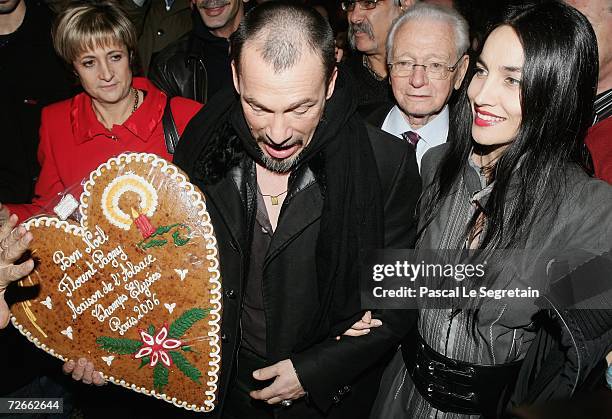 Singer Florent Pagny poses with his wife Azucena arives for the official Christmas lighting ceremony at The Champs Elysees November 28, 2006 in...