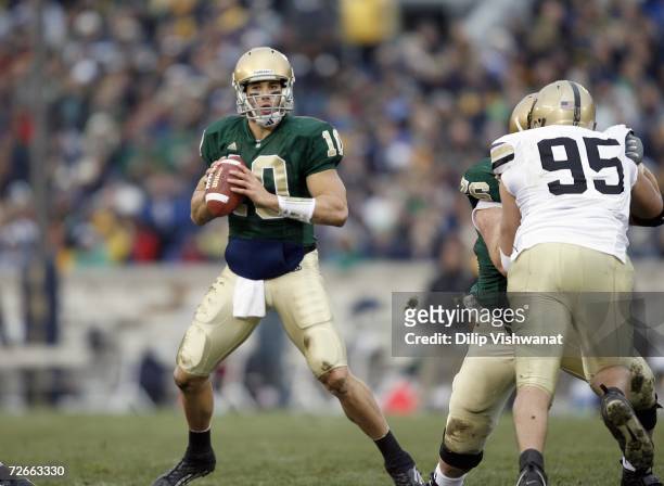 Brady Quinn of the Notre Dame Fighting Irish looks to pass against the Army Black Knights at Notre Dame Stadium November 18, 2006 in South Bend,...