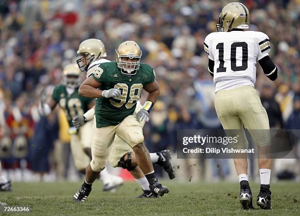 Trevor Laws of the Notre Dame Fighting Irish moves to sack Carson Williams of the Army Black Knights at Notre Dame Stadium on November 18, 2006 in...