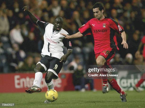 Patrick Agyemang of Preston North End in action against Clive Clark of Coventry City during the Coca Cola Championship match between Preston North...