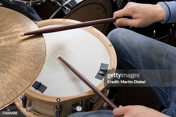 man playing the drums - drum stock pictures, royalty-free photos & images