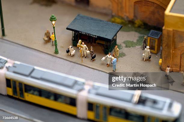 model of commuters waiting at tram stop - citylight mockup imagens e fotografias de stock