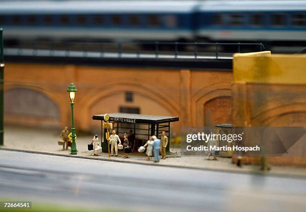 model of commuters waiting at bus stop - miniatures stock pictures, royalty-free photos & images