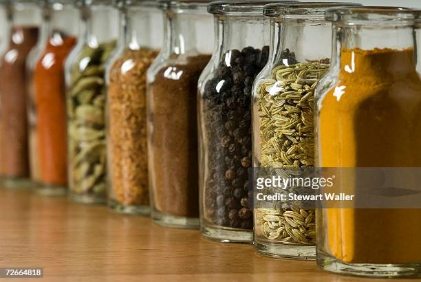 row of spice jars - jars kitchen stock pictures, royalty-free photos & images