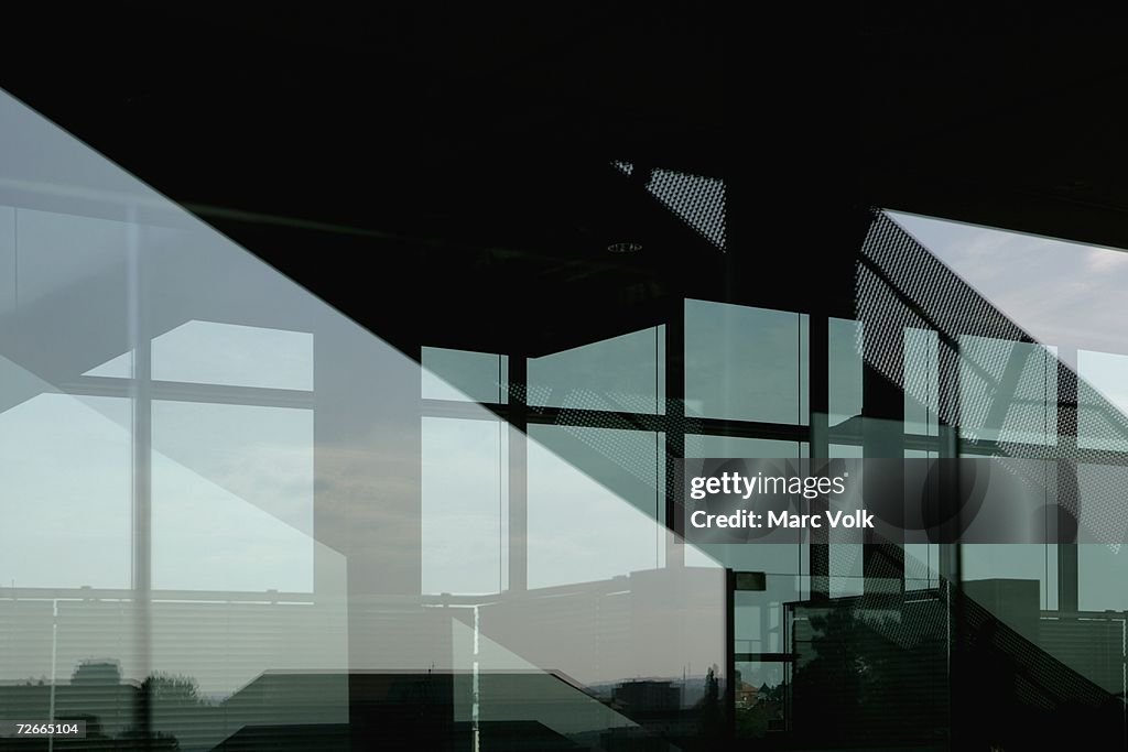 Modern foyer with reflection of cityscape in window