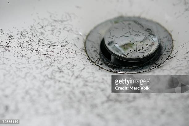 short snippets of human hair around bathroom drain - untidy sink stock pictures, royalty-free photos & images