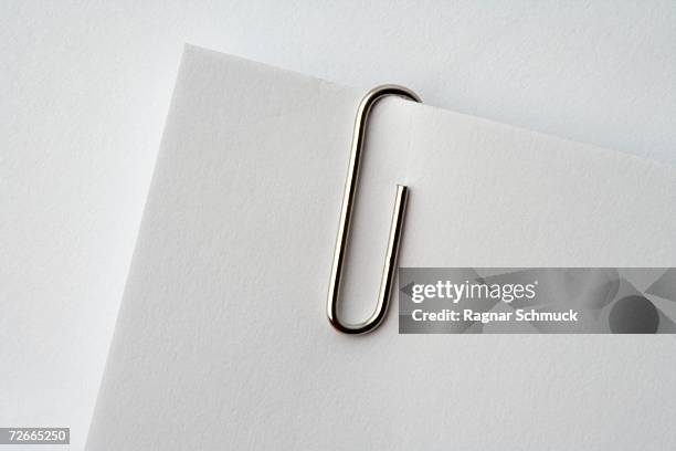 paper clip on corner of paper - paperclip imagens e fotografias de stock