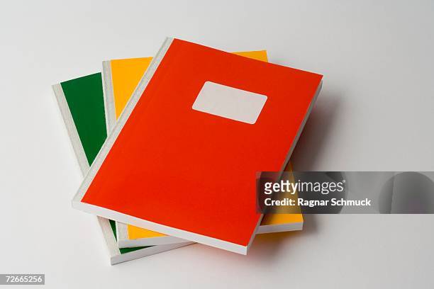 stack of three colored workbooks - workbook stock pictures, royalty-free photos & images