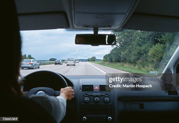 car traveling on multiple lane highway - multiple lane highway foto e immagini stock