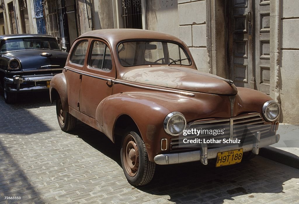 Old cars parked in street, Havana, Cuba
