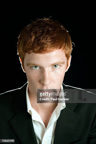 portrait of young man with red hair - shy foto e immagini stock