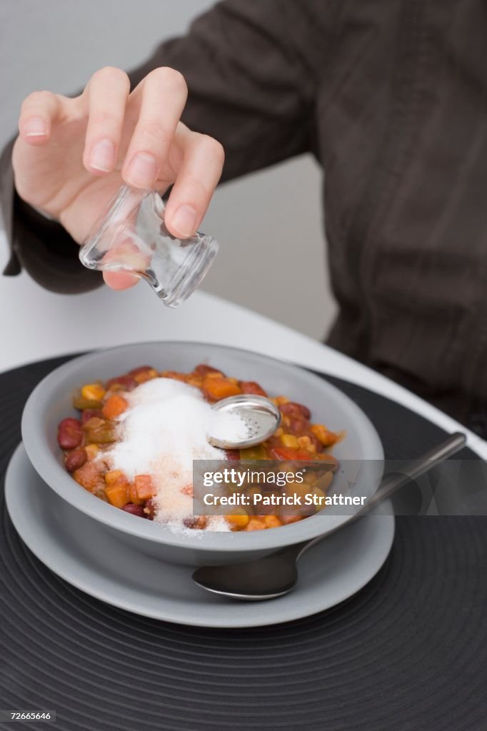 Empty Salt Man Holding Empty Salt Shaker Above Ruined Meal High-Res Stock Photo ...